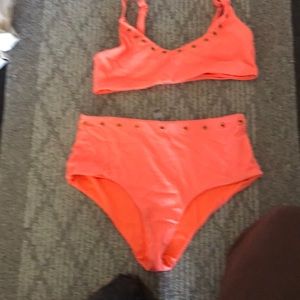 Coral bikini with gold accents